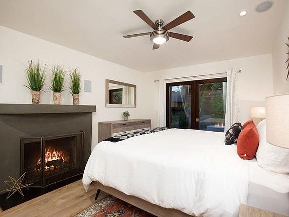 Master Bedroom with Natural Gas Fireplace and French Doors t