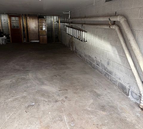 This is a 2 Car Garage with this apartment from front to back. Much larger in person then in picture. There is also a driveway into the garage for parking as well.