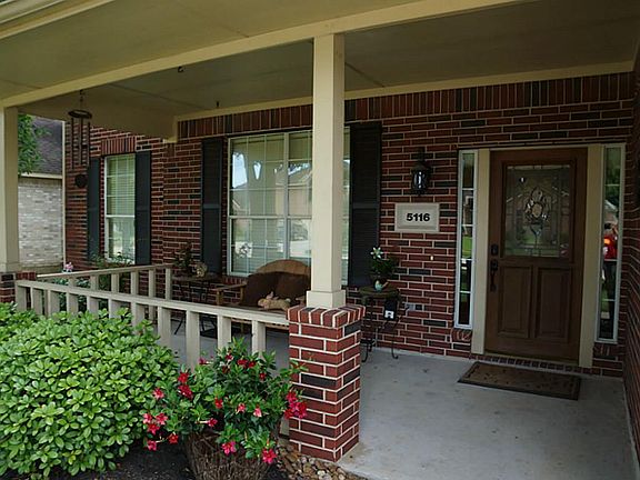 Wow... Look at this porch! Perfect for a swing and a cup of coffee!