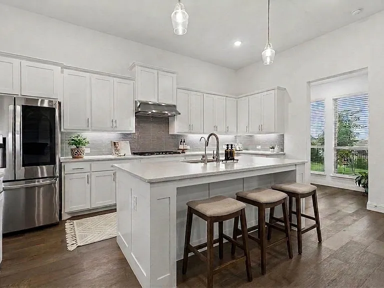 Refrigerator stays with the property. Like to cook together? This kitchen has a gas cooktop and plenty of prep space.