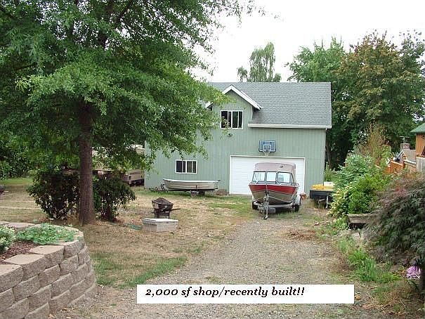 2000sf Shop recently built sits down a side driveway behind home