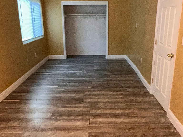 Oversized bedroom offering flexible space for a home office, nursery, fitness area, or additional living space.