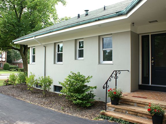 Sheltered entrance and attached garage