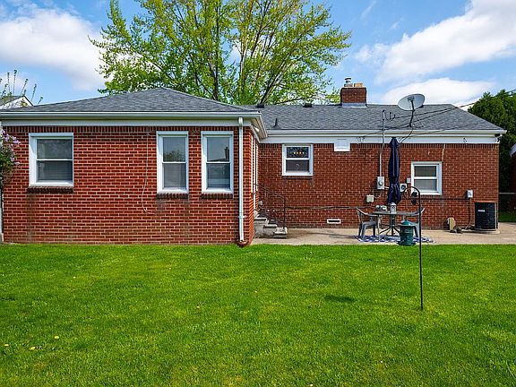 Back of home with patio