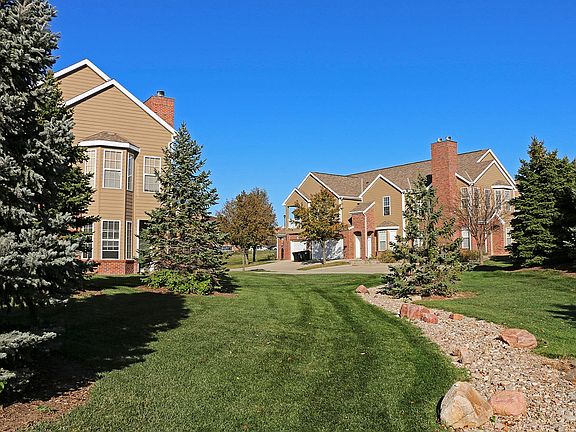 Tree-lined and beautifully landscaped green spaces create a welcoming community atmosphere.