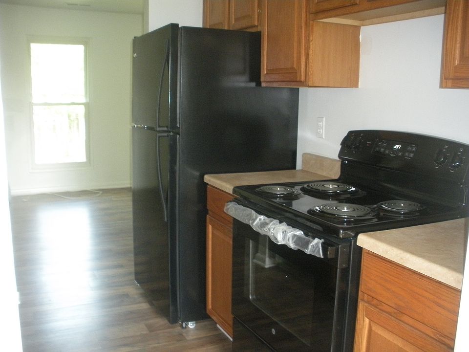 Galley Kitchen with Black Appliances