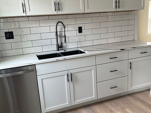 Upstairs kitchen with appliances and beautiful granite countertops