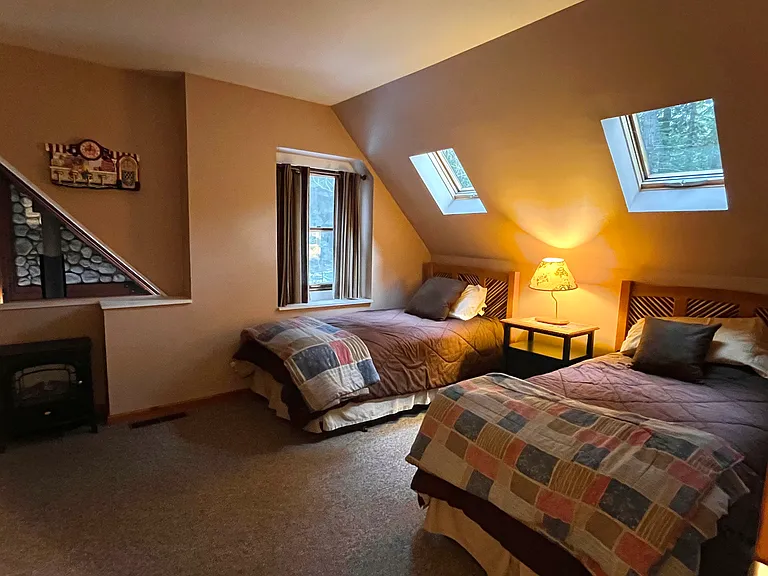 Twin bedroom upstairs in loft setting