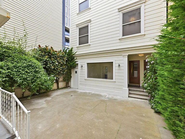 View of front of 1535 and small courtyard.