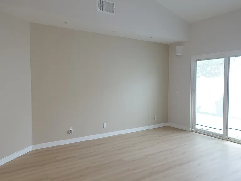 Living Room: Media nook and sliding doors to patio