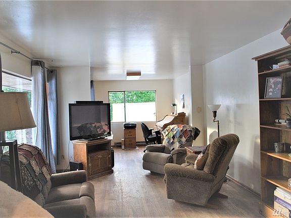 Living room with office space toward the back.