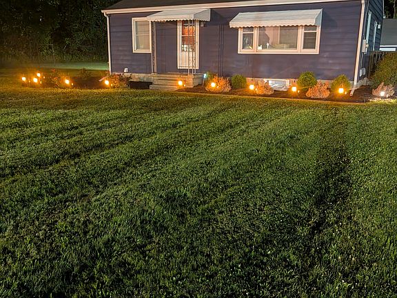 Nighttime photo of front yard.
