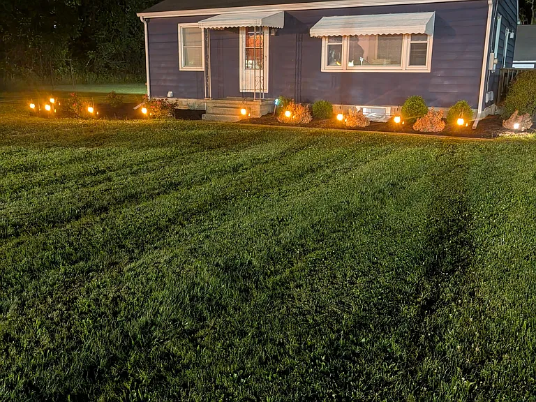 Nighttime photo of front yard.