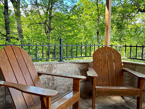 Enjoy Summer days on the covered porch, overlooking the river.