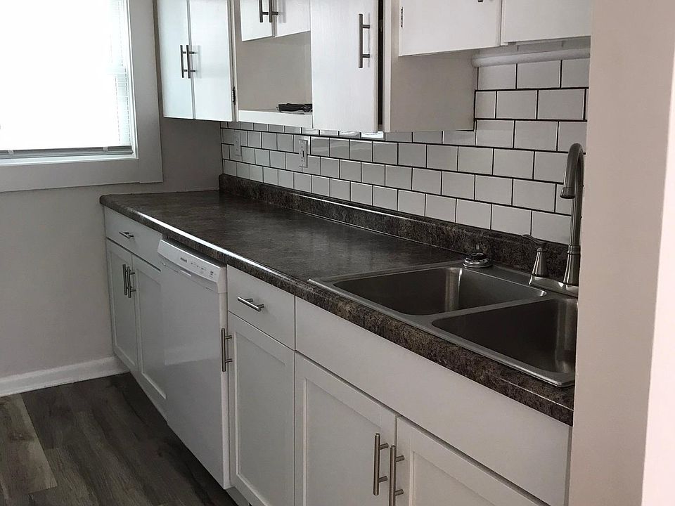 Newly renovated kitchen features new dishwasher.
