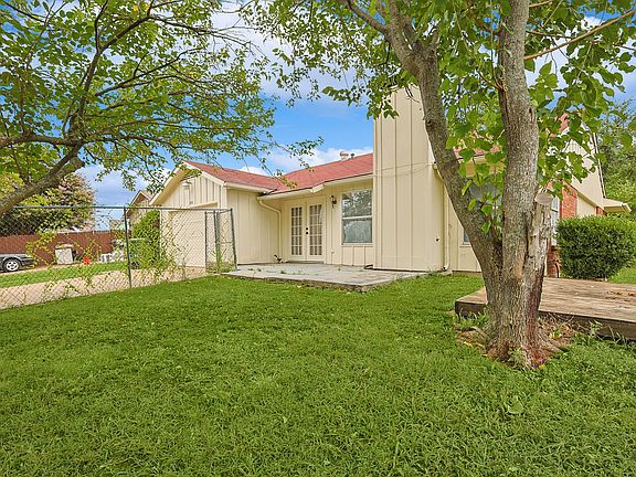 A view of the fully-fenced backyard of the property.
