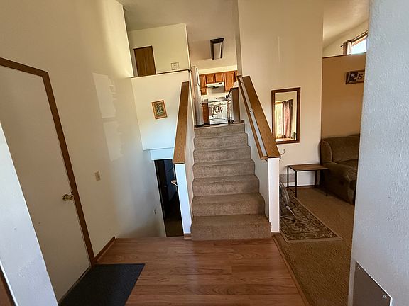 Entry from the front door, living room to the right, up and right dining room, down and right family room.