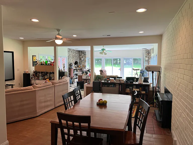 Living room/dining room, sunroom with furniture for scale