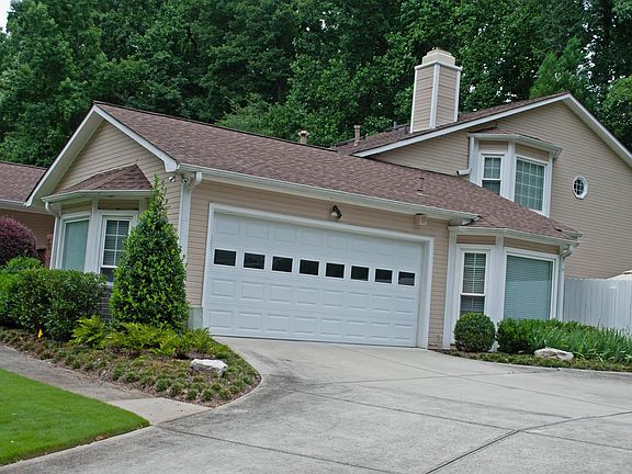 2-Car Garage with extra storage and overflow refrigerator