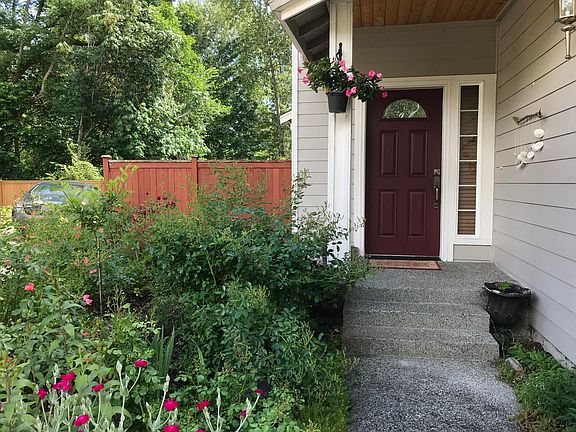Front Door With A Beautiful Flower Garden