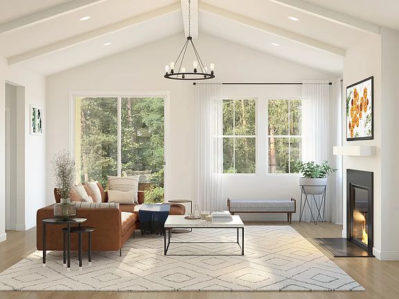 Great room with fireplace and white painted ceiling beams