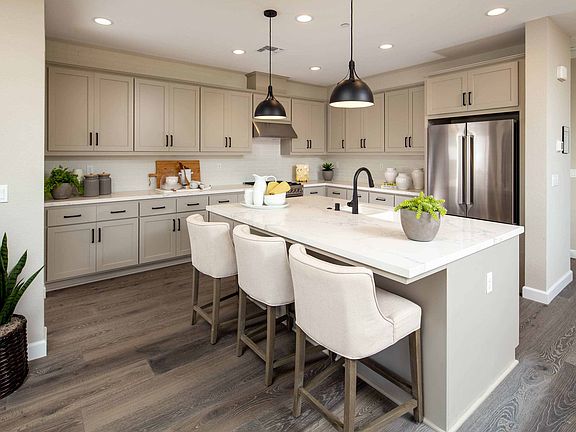 Open-concept design at its finest--the kitchen--boasting large island with set-in sink and ample cou