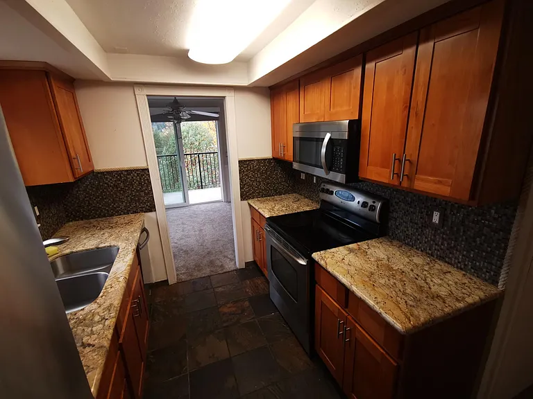 Kitchen opens out to breakfast nook area and view.