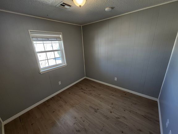 Middle bedroom (closet to the left, not pictured). Across the hall from the hall bathroom.