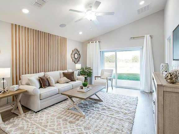 Enjoy a bright, open-concept living area - Amaryllis by Highland Homes