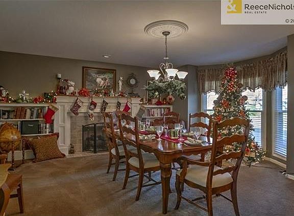 Large Front Room;  this room is used as a large dining room, but can also be used as a Formal Living Room.  Bay Window adds great natural light and extra square footage.  Gas Fireplace is a wonderful focal point and is framed by built-in bookshelves.
