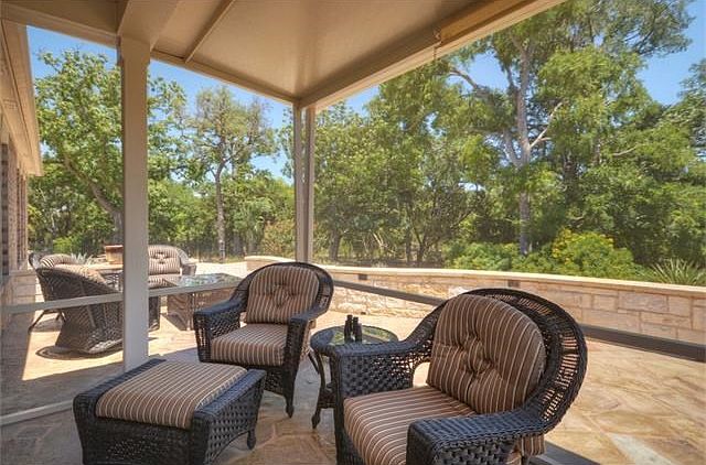Panoramic views of the woodsy banks of Cowan Creek offer year-around enjoyment at this fabulous and private back yard, where a shady Screened Porch opens onto a wide xeriscaped back yard with endless scenery.