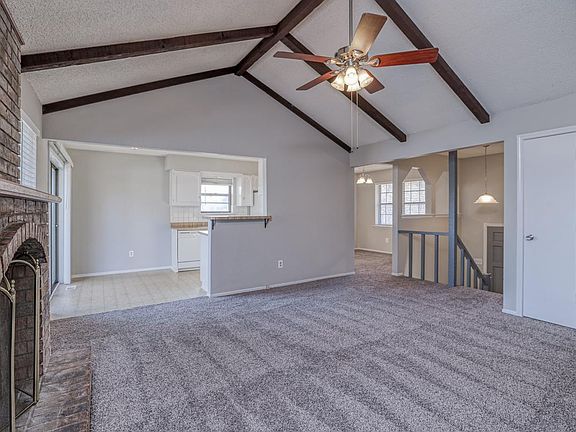 Open to kitchen and dining room.