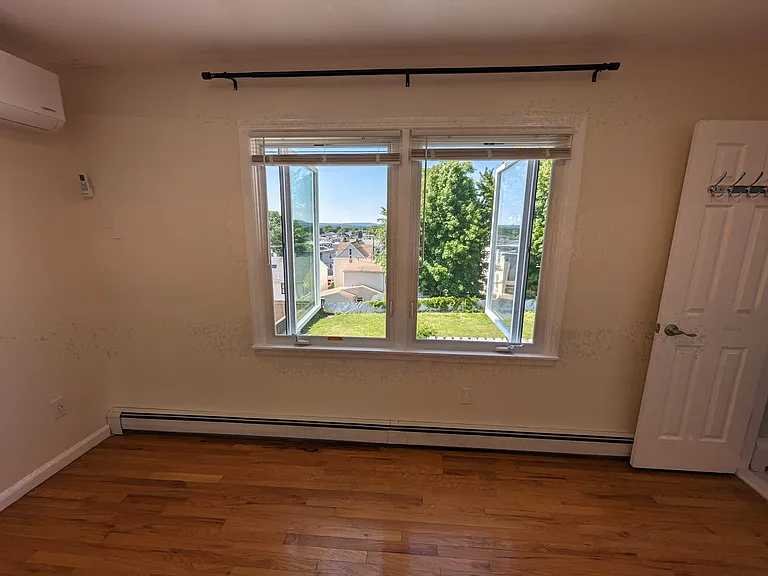Master bedroom with double casement windows bringing in an AMAZING breeze.