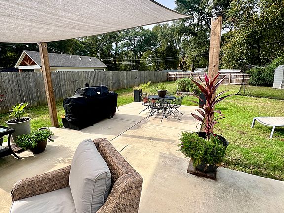 Privacy fenced in back yard, great for BBQ's, parties, and get togethers.