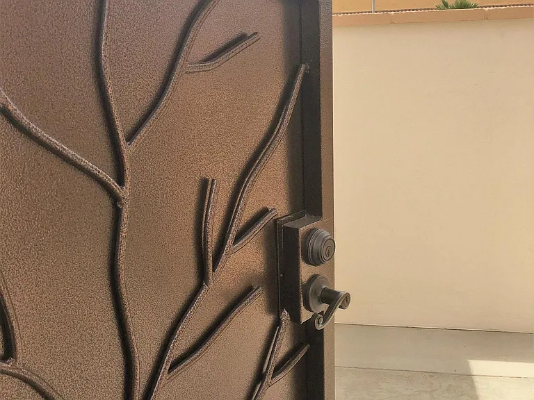 BEAUTIFUL DETAILS ON THE GATED ENTRANCE TO THE PATIO
