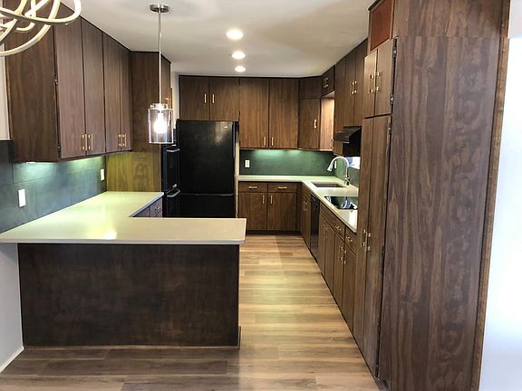 kitchen space with lots of cabinets and pantry