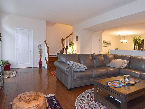 The living room is spacious and has lot of natural light.