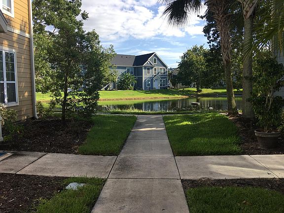Walkway past front door to lake.