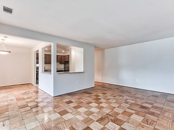 Living and dining room area with wood floor