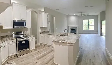 Upgraded open concept kitchen with granite counter tops
