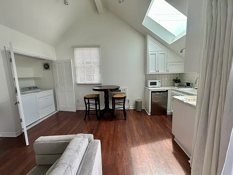 Third bedroom has separate entry with kitchenette and en suite bathroom. Laundry room located in this room.