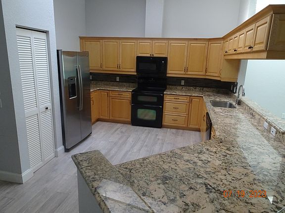 This full size kitchen has dishwasher, disposal, double oven, microwave and a four seat counter for entertaining