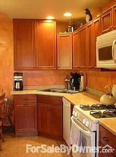 Hardwood Floors show up in bright living and dining room.