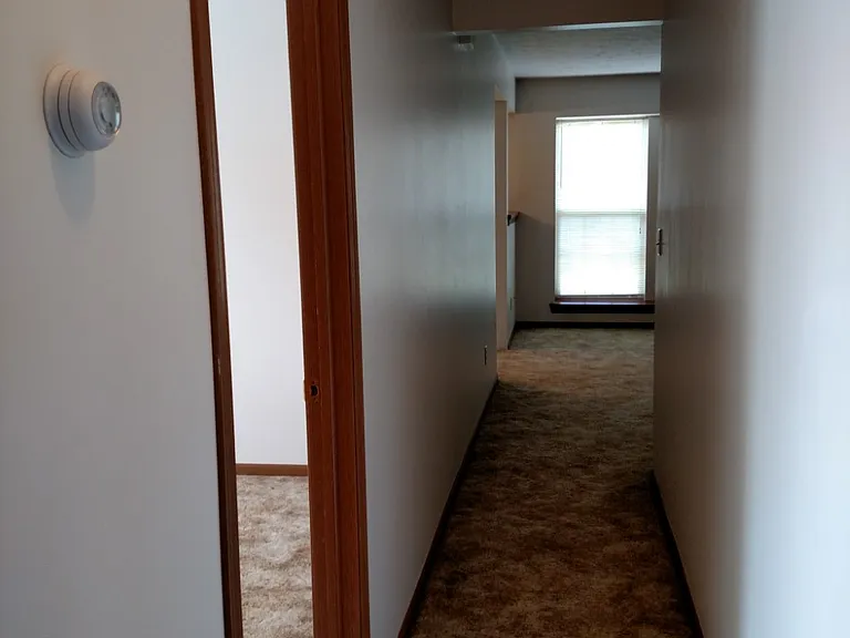 Looking down hallway into living room.
