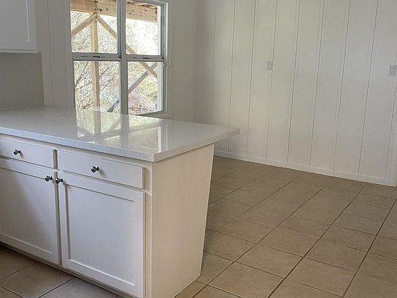 Plenty of room for a 6-person table and bar stools at the counter