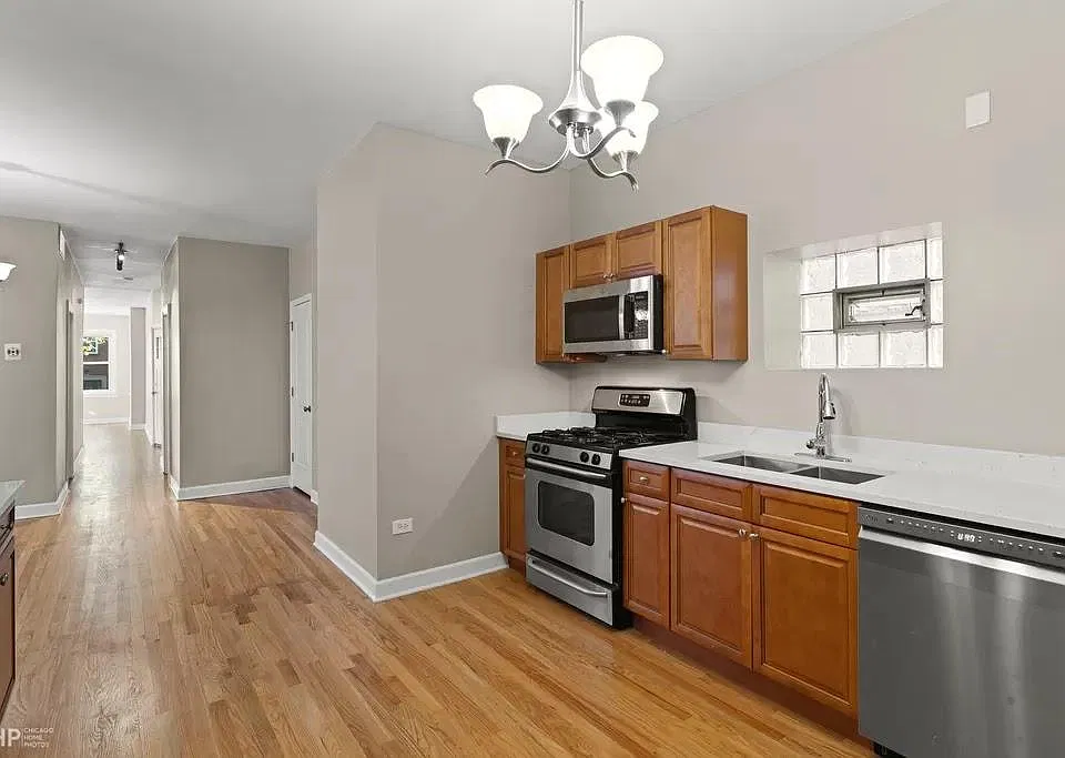 Kitchen and adjoining interior space.