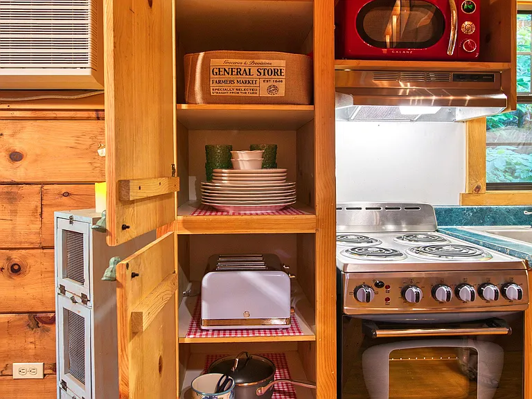 Kitchen equip with toaster, blender, Keurig, plates, pots and pans