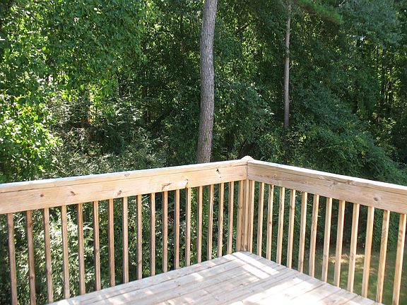 large deck overlooking private backyard