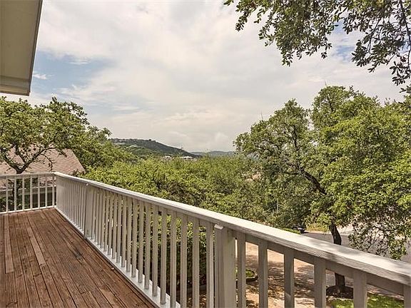 View from the front wrap around balcony.  Enjoy beautiful sunrise and sunset skies and feel as if you're relaxing in a treehouse!