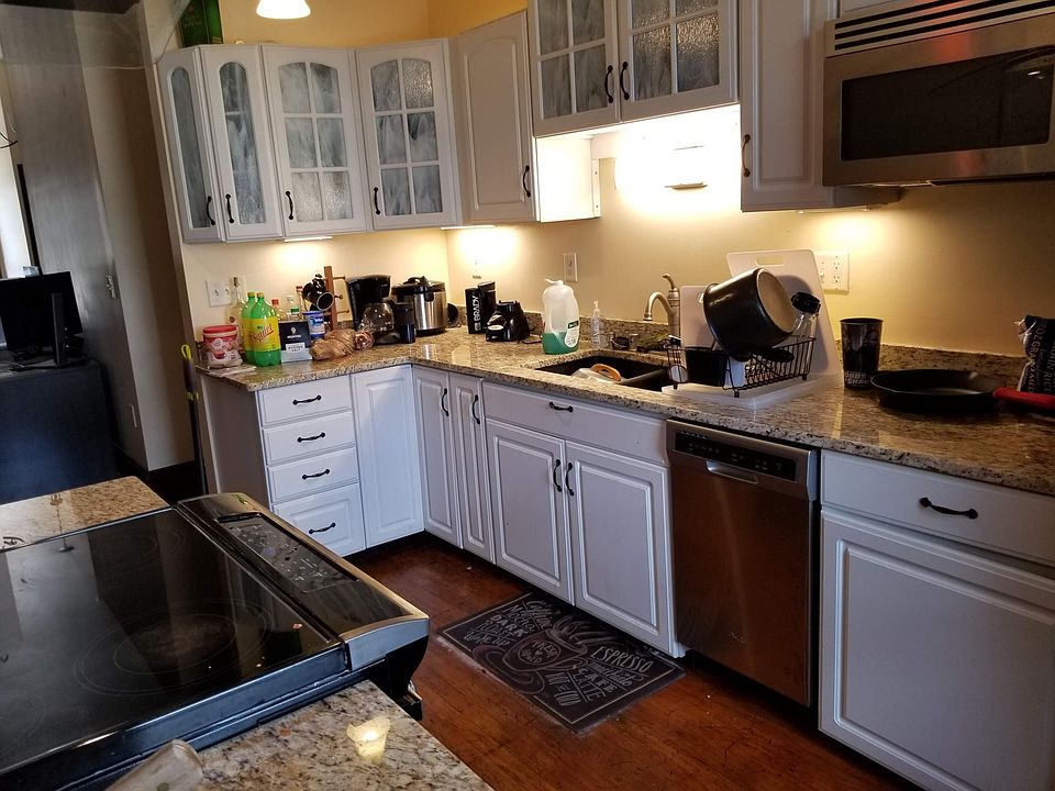 View of kitchen looking toward half bath entry